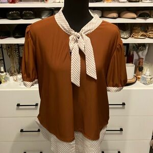 Women’s size large burnt orange & polka dot top with bow.